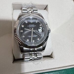 Rolex Silver Timepiece with Dark Dial